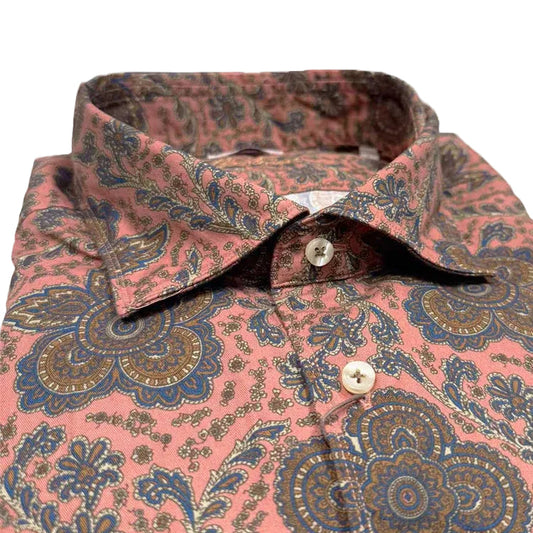 Pink floral patterned shirt on a white background