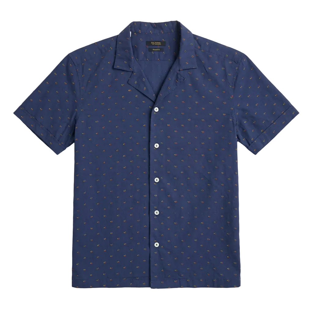 A close-up of a navy blue button-down shirt with a small repeating orange and yellow embroidered pattern, featuring white buttons and a visible Ralph Lauren neck label.
