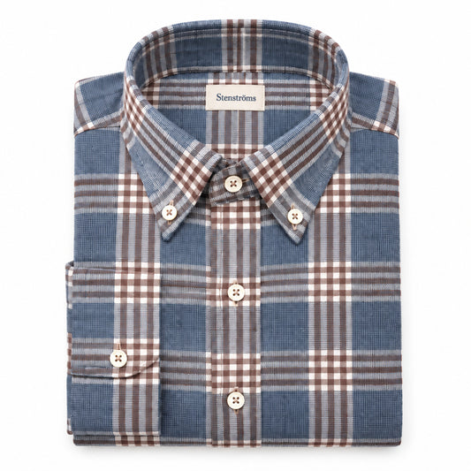 Close-up of a plaid shirt with a focus on the collar and buttons.
