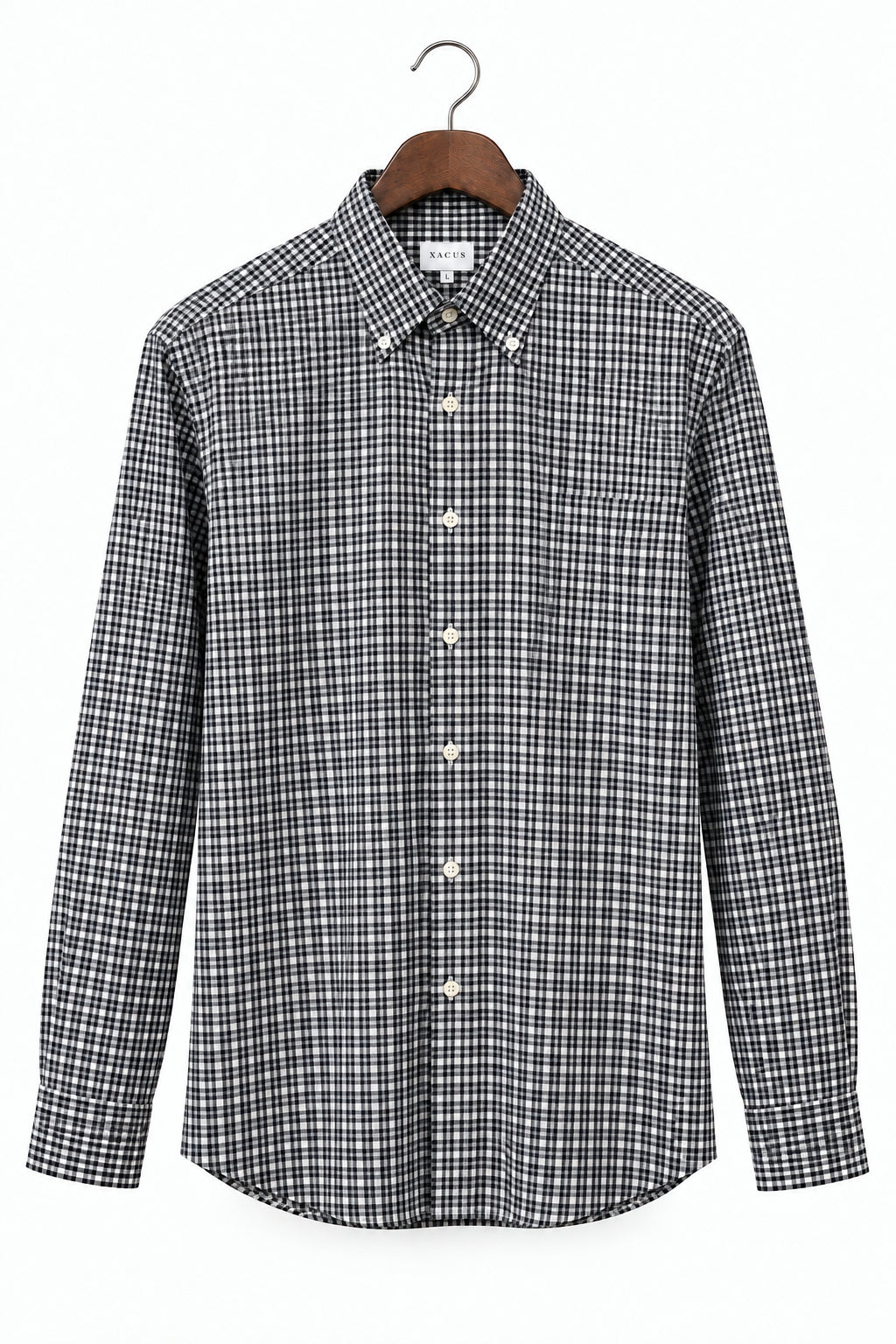 A long-sleeve button-down shirt with a black and white micro-check pattern, hanging on a wooden hanger against a plain white background.