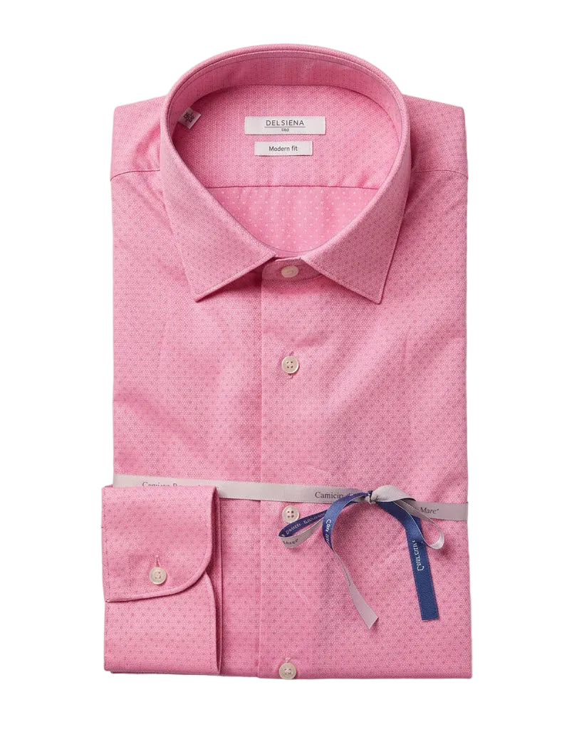 A folded pink dress shirt with a subtle micro-dot pattern, featuring a pointed collar, button-down front, and a matching pink neck ribbon tied with a blue bow, shown on a light gray background.